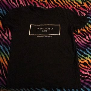 A black "Fashionably Late" shirt